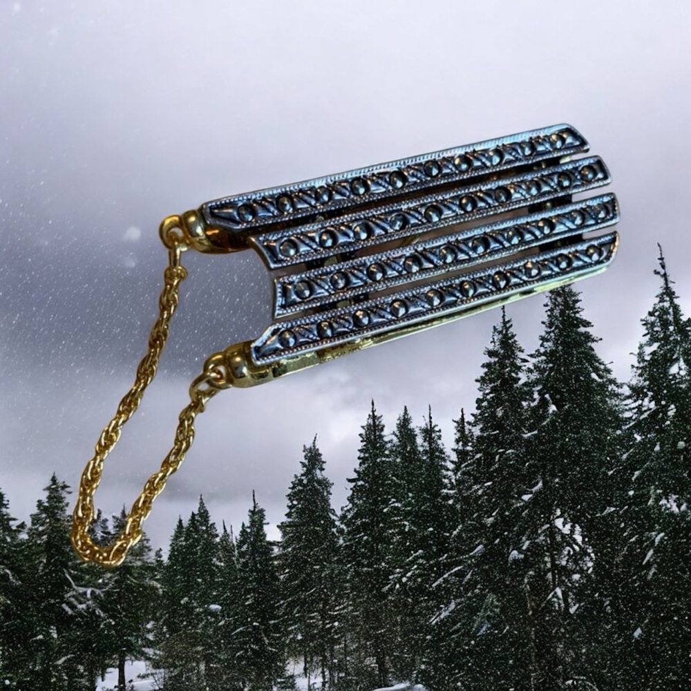 Vintage Darlene snow sled brooch with marcacite accents